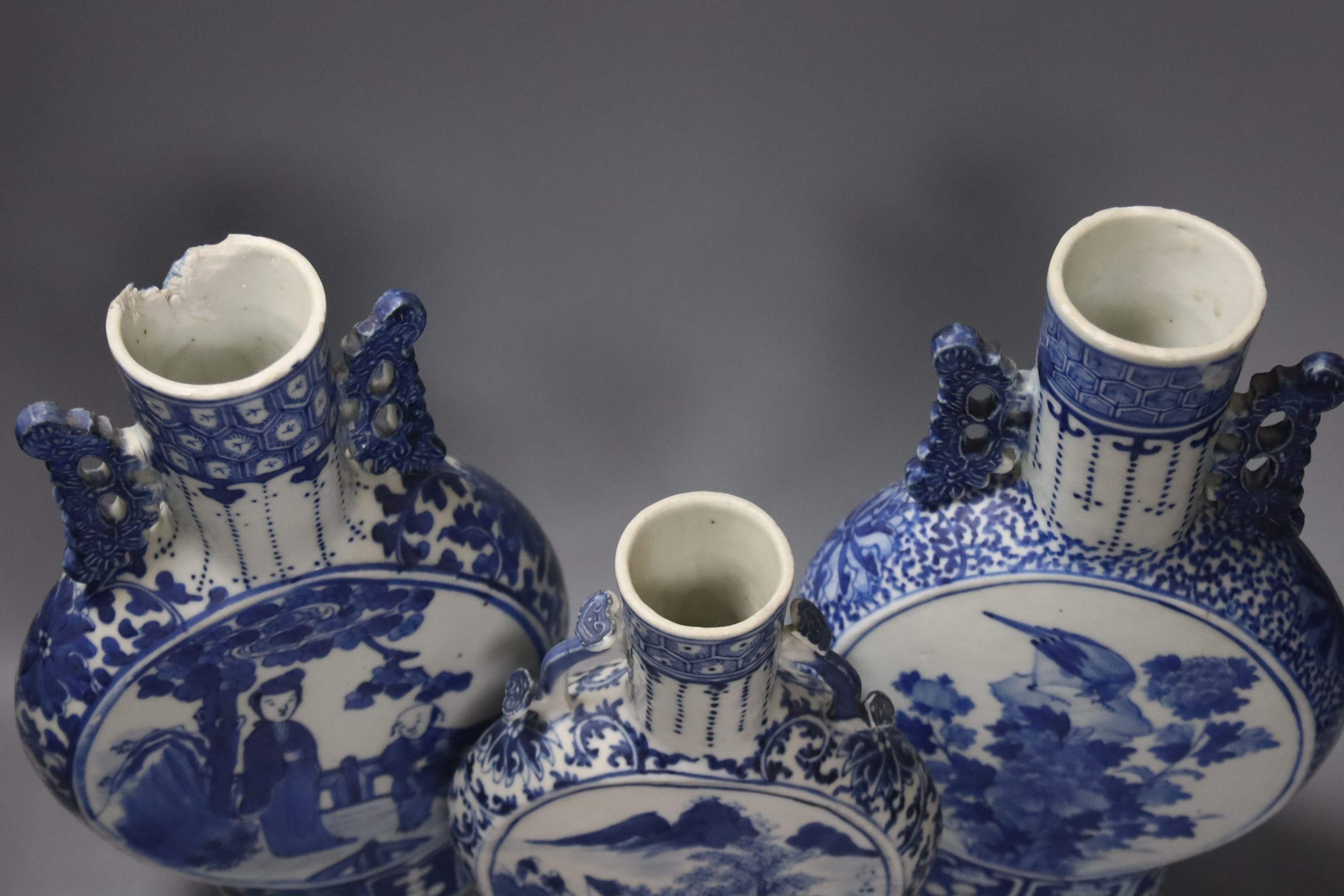 Three 19th century Chinese blue and white Moon flasks, tallest 31 cms.